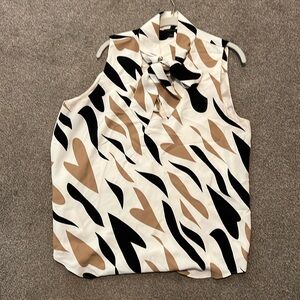 Ann Taylor sleeveless with tie neck.